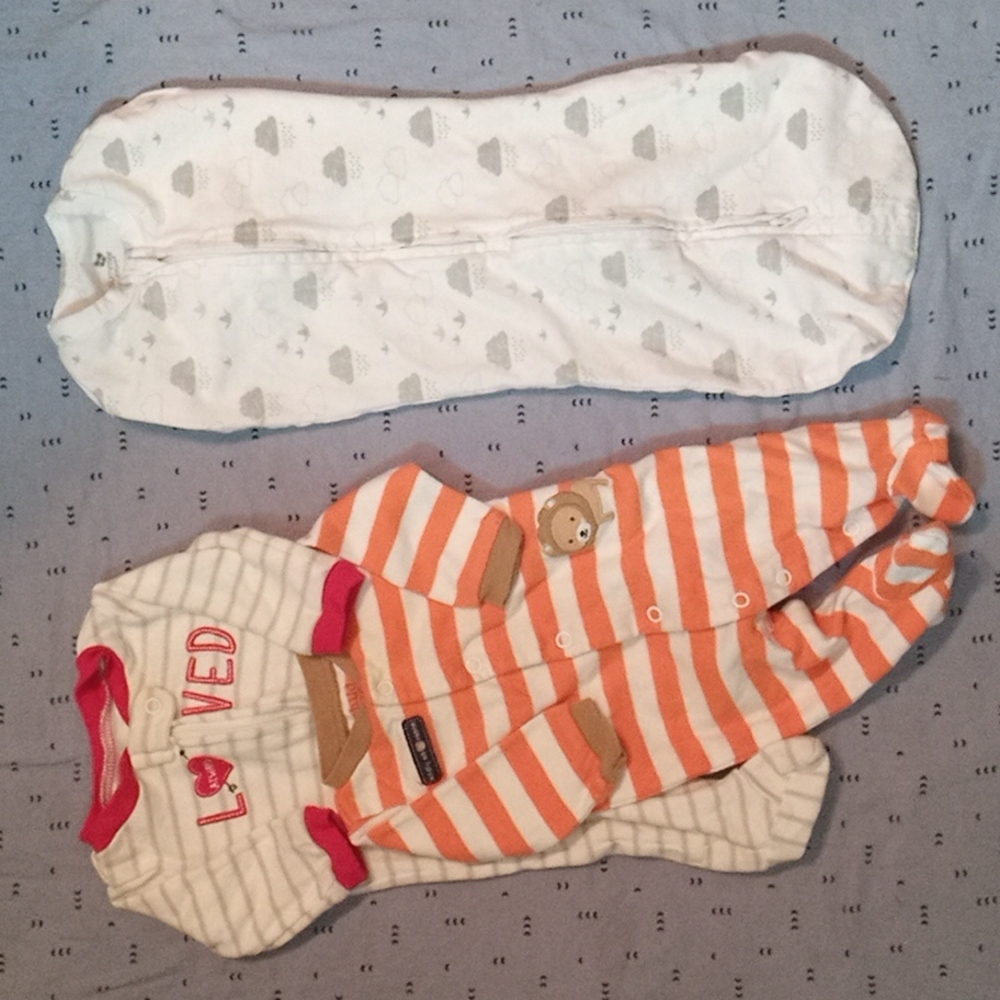 Newborn size, 2 footed long sleeve pajamas and one Summer Infant swaddle.